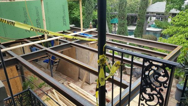 metal support structure being placed at a construction site